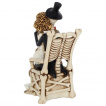 Figurine couple de squelettes mariés sur une chaise en os (25cm)