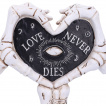 Mains squelettes formant un coeur
