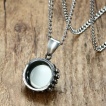 Pendentif acier inox à oeil vert
