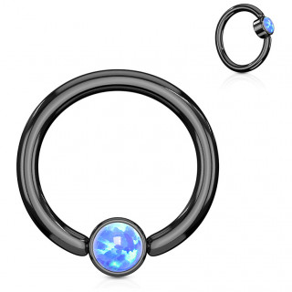 Anneau noir  cylindre captif serti d'une opale bleue