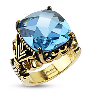 Bague mixte acier dore  structure fleur de Lys et pierre bleue